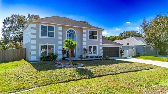 view of front facade featuring a front yard and a garage