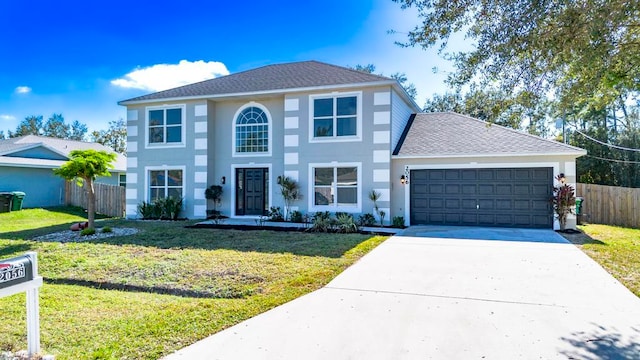 view of front facade featuring a garage and a front lawn