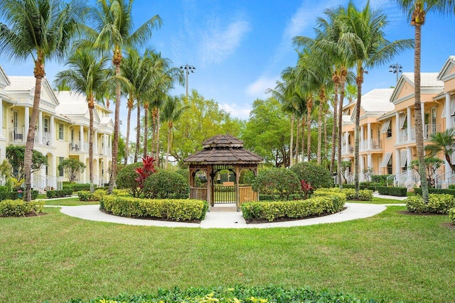 view of property's community with a yard and a gazebo