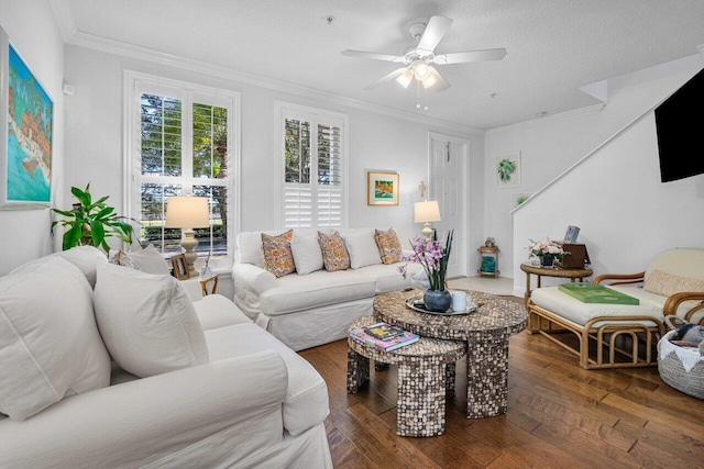 living room featuring ceiling fan, dark hardwood / wood-style floors, a textured ceiling, and crown molding