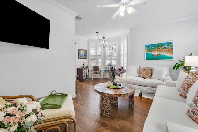 living room featuring ornamental molding, dark hardwood / wood-style floors, and ceiling fan with notable chandelier