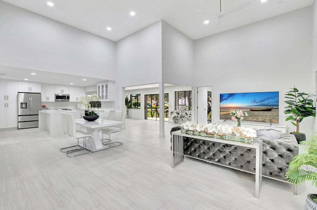 living room with a towering ceiling