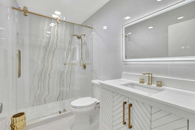 bathroom with vanity, toilet, and an enclosed shower