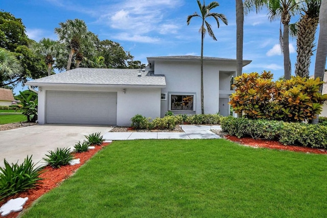 view of front facade with a garage and a front yard