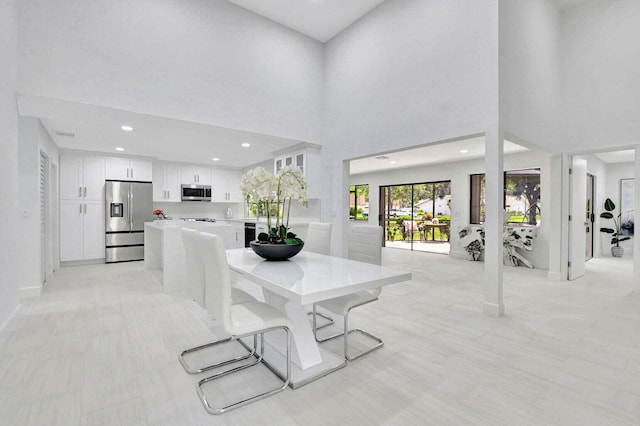 dining space with a high ceiling