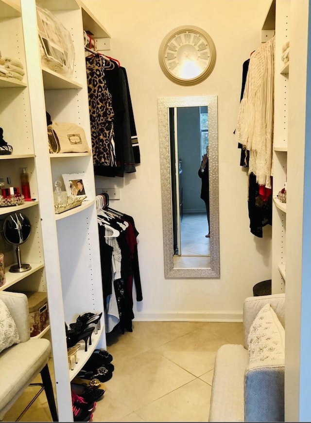 spacious closet featuring light tile patterned floors