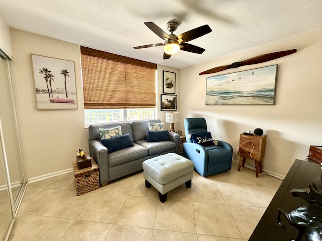 living room with light tile patterned floors and ceiling fan