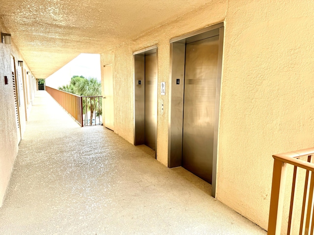 hallway featuring elevator