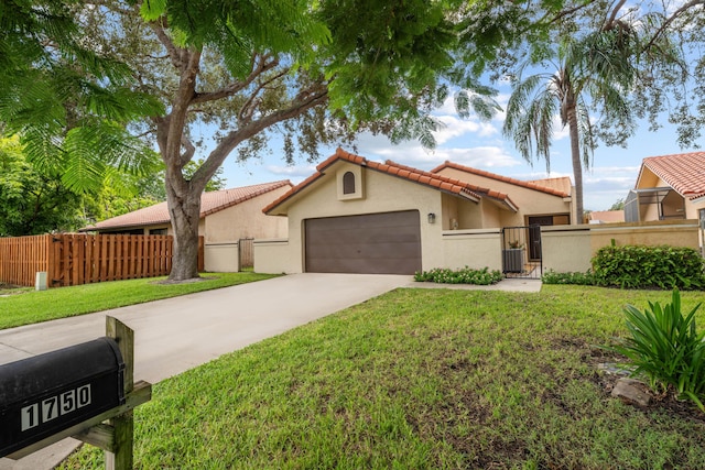 view of front of home featuring a garage and a front lawn