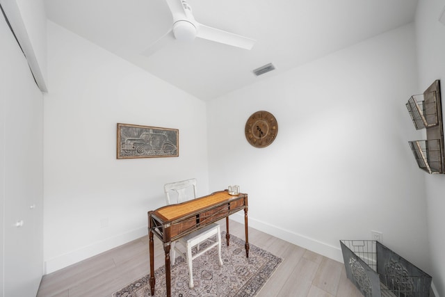 home office with light hardwood / wood-style floors, vaulted ceiling, and ceiling fan