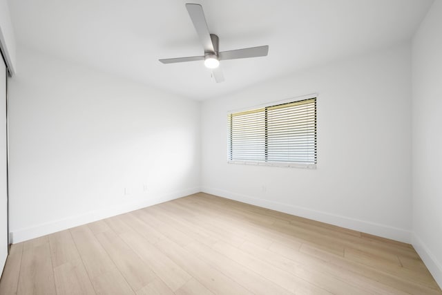 unfurnished bedroom with ceiling fan, a closet, and light hardwood / wood-style floors