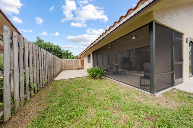 view of yard with a patio area and a sunroom