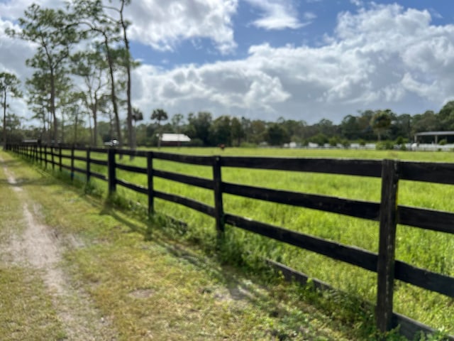 view of gate featuring a rural view