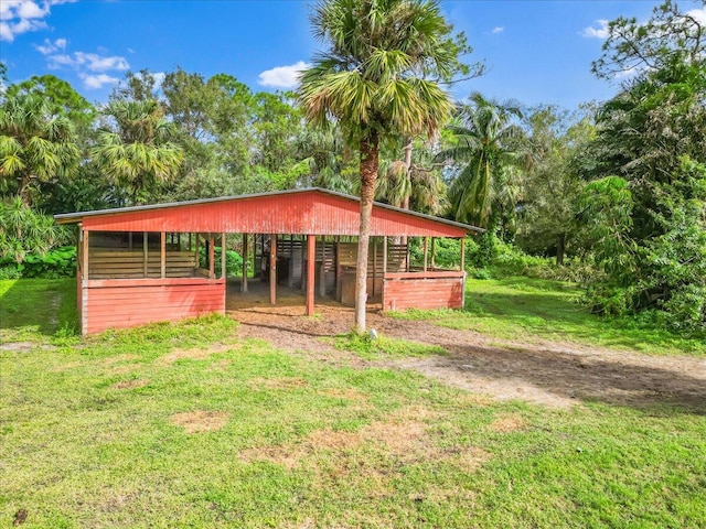 view of front facade featuring an outbuilding