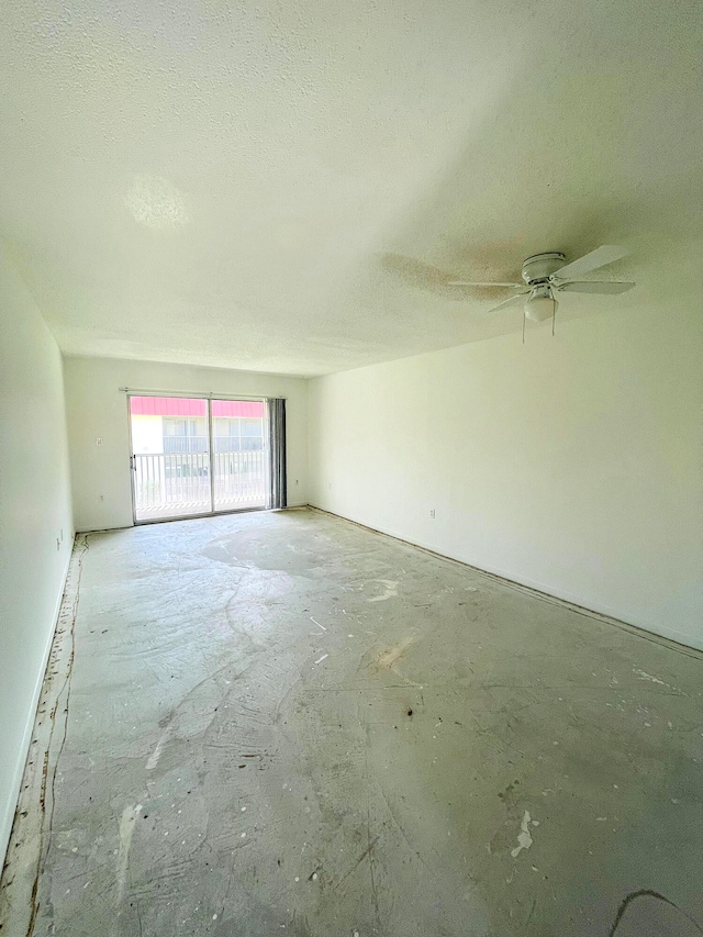 empty room featuring a textured ceiling and ceiling fan