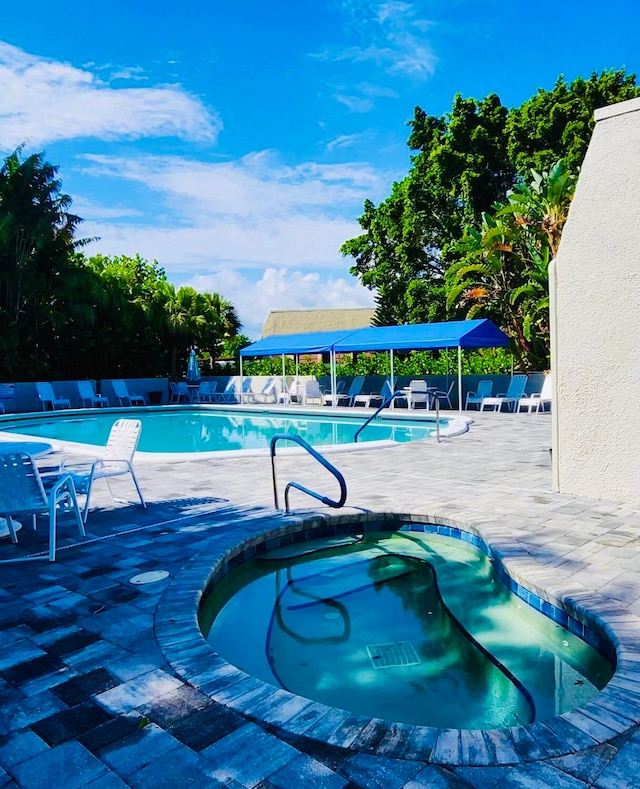 view of swimming pool featuring a patio area