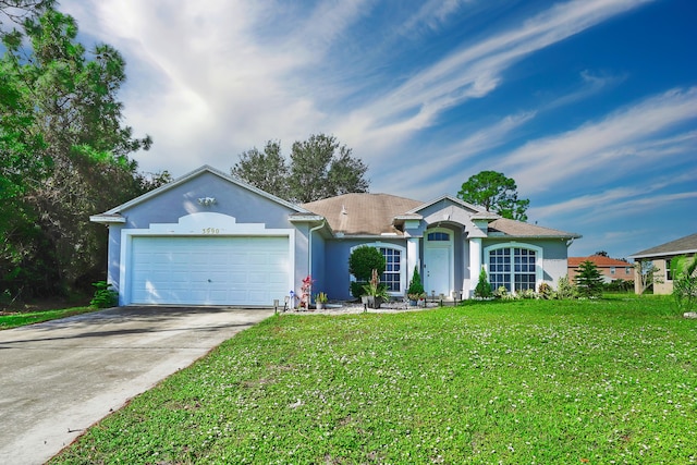 ranch-style home featuring a garage and a front lawn