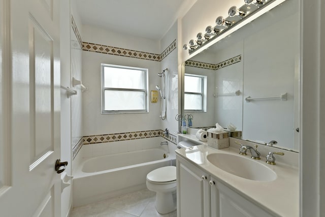 full bathroom featuring tile patterned flooring, vanity, toilet, and washtub / shower combination