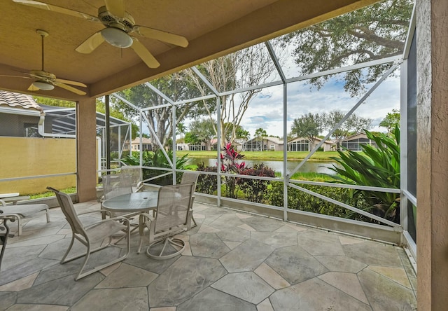 unfurnished sunroom with a water view