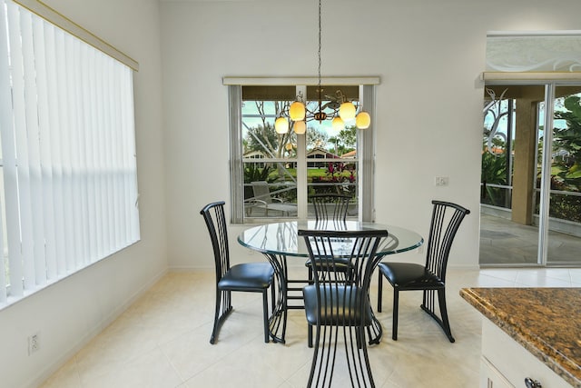 dining space featuring a notable chandelier