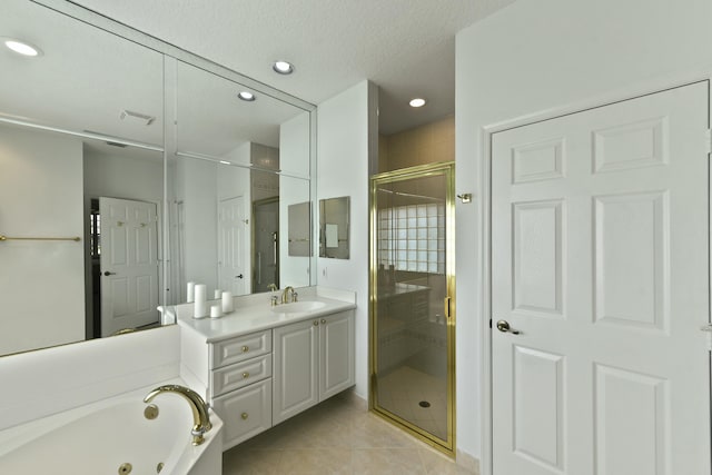 bathroom with tile patterned flooring, a textured ceiling, vanity, and independent shower and bath