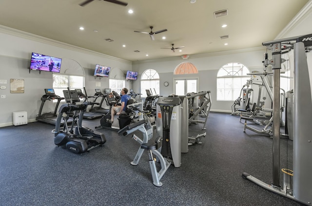 gym with ceiling fan and crown molding