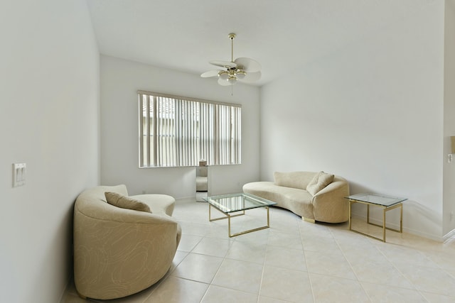 living room featuring light tile patterned floors and ceiling fan