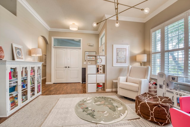 sitting room featuring hardwood / wood-style flooring and ornamental molding