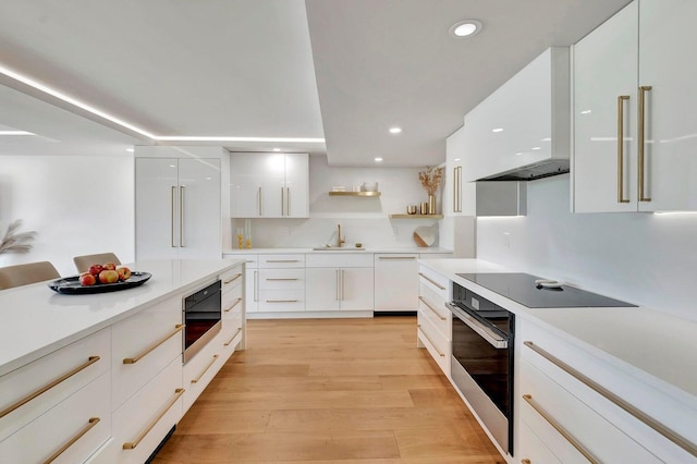 kitchen featuring white cabinets, sink, stainless steel oven, white dishwasher, and built in microwave