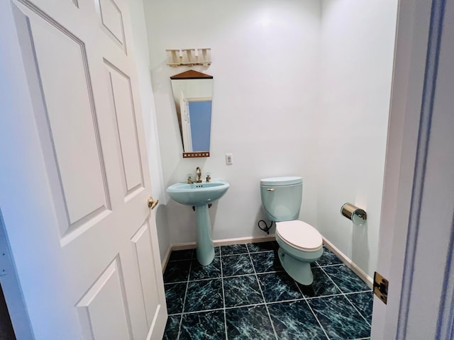 bathroom featuring walk in shower, vanity, and tile patterned floors