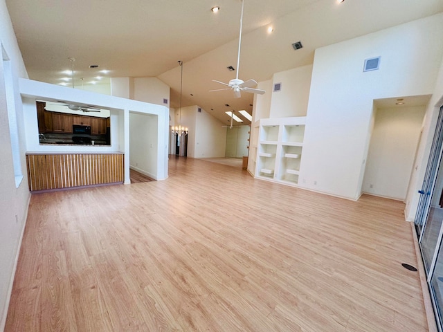 kitchen with light hardwood / wood-style floors, sink, black appliances, ceiling fan, and decorative backsplash