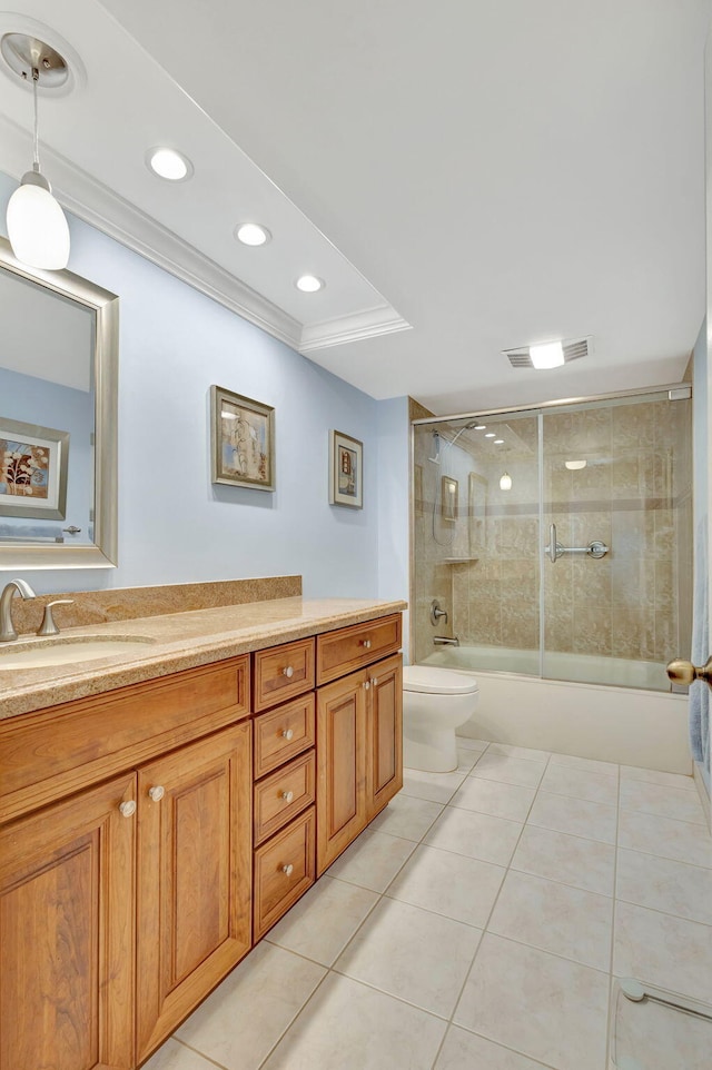 full bathroom with tile patterned floors, vanity, toilet, and enclosed tub / shower combo