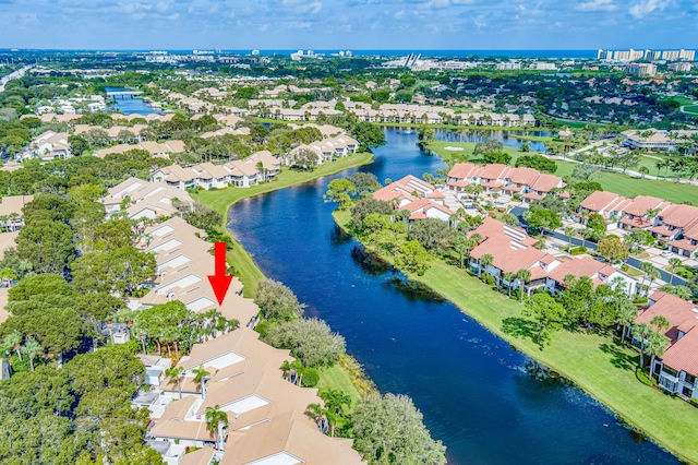 birds eye view of property featuring a water view