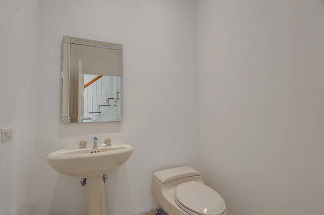 bathroom featuring toilet