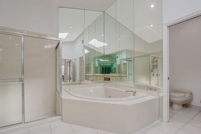 bathroom featuring independent shower and bath, tile patterned flooring, and a skylight