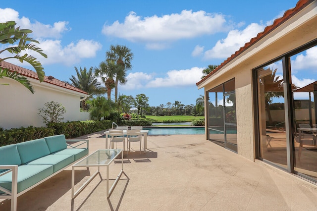 view of patio with outdoor lounge area and a water view