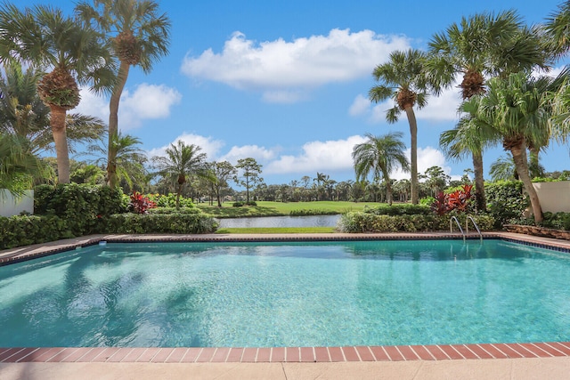 view of pool featuring a water view