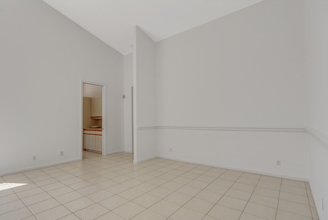 tiled empty room with high vaulted ceiling