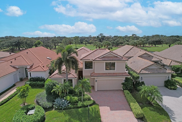 view of front facade with a garage and a front lawn