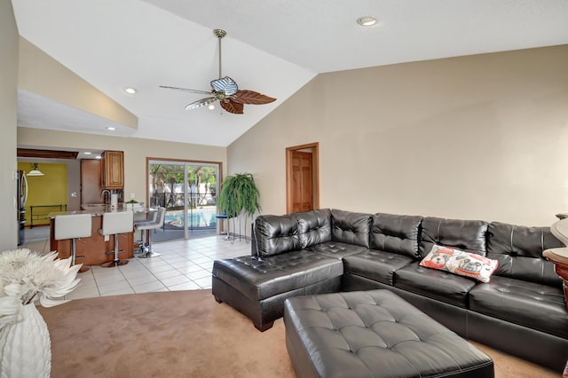 tiled living room with high vaulted ceiling and ceiling fan