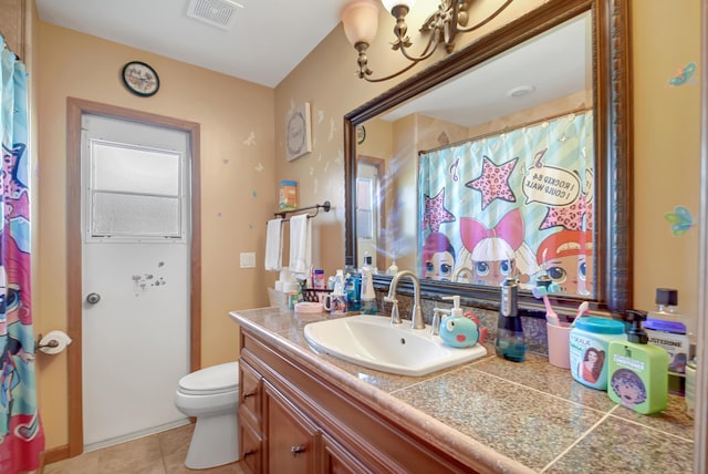 bathroom with tile patterned flooring, vanity, toilet, and a shower with shower curtain