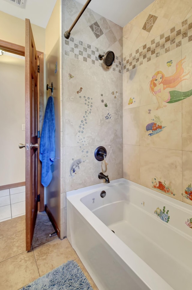 bathroom with tile patterned flooring and tiled shower / bath