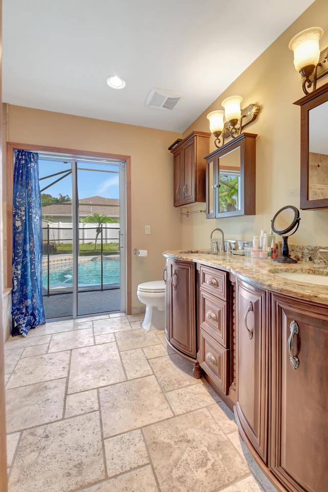 bathroom with vanity and toilet