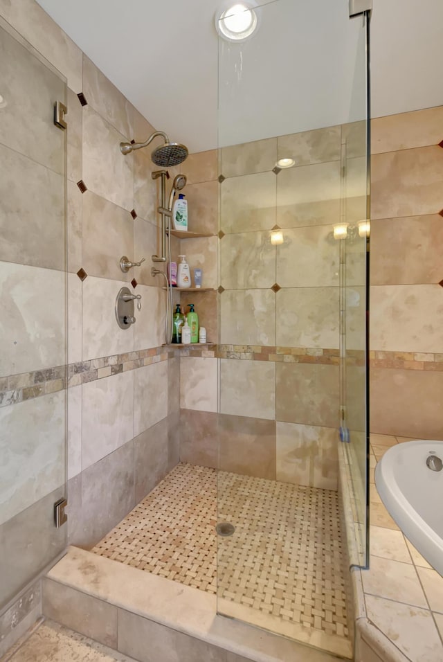 bathroom with shower with separate bathtub