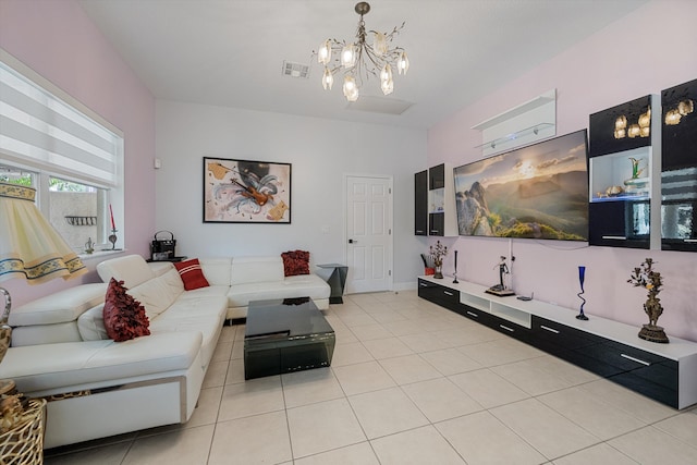 tiled living room with an inviting chandelier