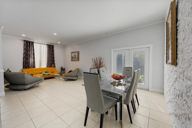 tiled dining area with ornamental molding and french doors