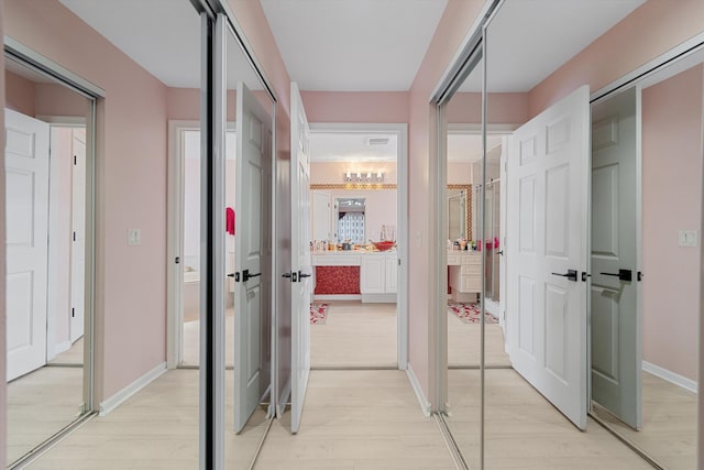 hallway featuring light wood-type flooring