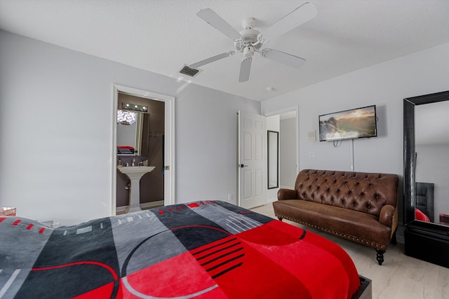 bedroom with ceiling fan and sink