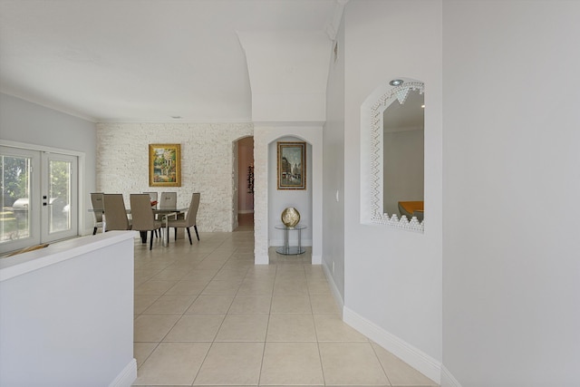 hall with light tile patterned floors