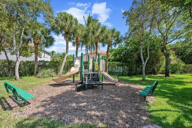 view of jungle gym featuring a lawn